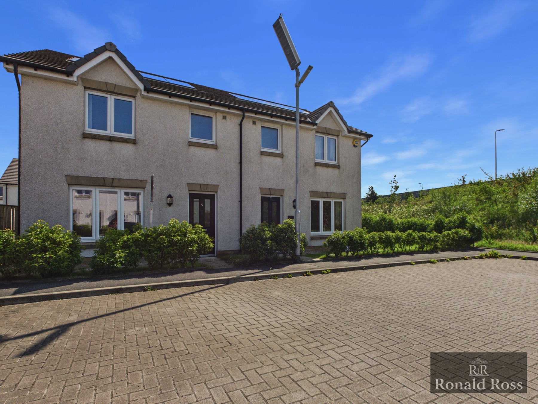 A modern rendered semi-detached new-build home from a Ronald Ross listing