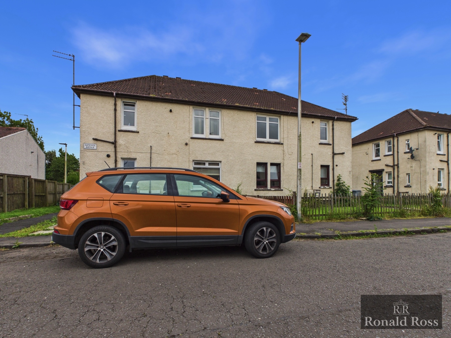 A traditional two-storey flatted block on Gateside Avenue from a Ronald Ross listing